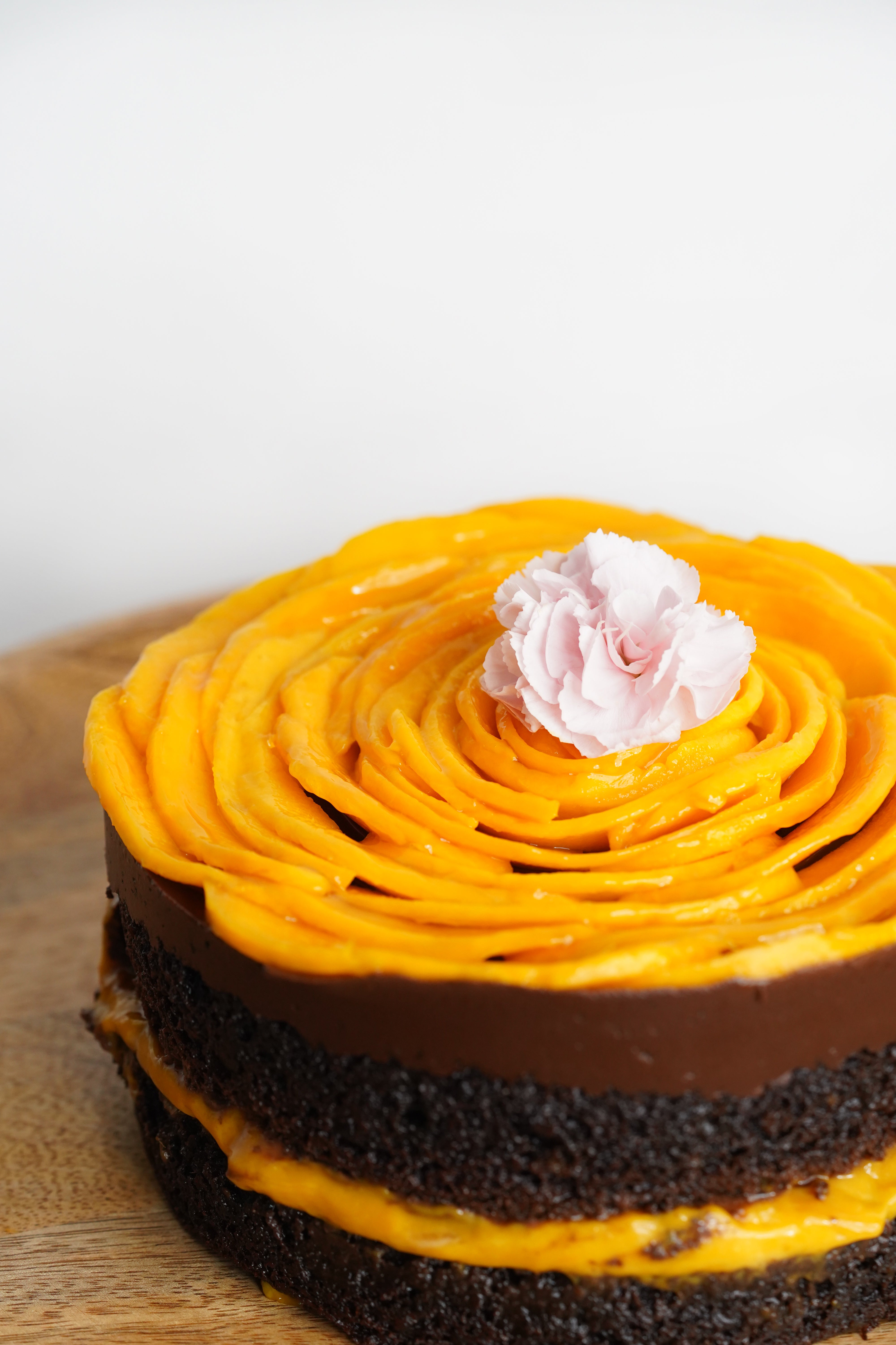 Layered Mango & Dark Chocolate Icing Cake